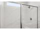 Elegant shower with frameless glass door and a marble tile surround at 17837 W Mission Ln, Waddell, AZ 85355