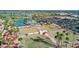 Aerial view showcases tennis and bocce ball courts, landscaping and easy access to parking at 18522 N Mica Dr, Sun City West, AZ 85375