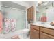 Bathroom showcasing shower with glass doors, sink with wooden cabinet, and neutral colored walls at 18522 N Mica Dr, Sun City West, AZ 85375