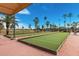 Outdoor bocce ball courts surrounded by palm trees, perfect for social gatherings and leisurely games at 18522 N Mica Dr, Sun City West, AZ 85375