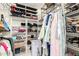 Organized walk-in closet with ample storage space for shoes and clothing at 18522 N Mica Dr, Sun City West, AZ 85375