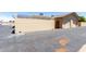 Street-level view of the home's garage and side-yard, showing privacy wall and roof with solar panels at 18522 N Mica Dr, Sun City West, AZ 85375