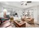 Bright living room with sliding glass doors, comfortable seating, and stylish decor at 18522 N Mica Dr, Sun City West, AZ 85375