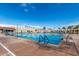 An outdoor lap swimming pool with blue lane dividers and starting blocks offers a place for both exercise and community gatherings at 18522 N Mica Dr, Sun City West, AZ 85375