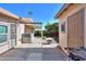 Backyard featuring a covered patio, lush greenery, and a fire pit, creating an inviting outdoor living space at 1855 N Rim Rock Dr, Casa Grande, AZ 85122