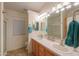 Well-appointed bathroom with double sinks, a mirror with vanity lighting, and a shower, providing a luxurious and convenient space at 1855 N Rim Rock Dr, Casa Grande, AZ 85122