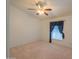 Well-lit bedroom featuring neutral carpet, ceiling fan, and a window offering natural light and a serene ambiance at 1855 N Rim Rock Dr, Casa Grande, AZ 85122