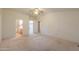 Comfortable bedroom with a ceiling fan and access to an ensuite bathroom and a walk-in closet for added convenience at 1855 N Rim Rock Dr, Casa Grande, AZ 85122