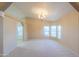 Bright dining area with elegant chandelier and plenty of natural light at 1855 N Rim Rock Dr, Casa Grande, AZ 85122