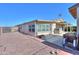 Single-story home featuring desert landscaping, a covered patio, and gravel ground for low maintenance at 1855 N Rim Rock Dr, Casa Grande, AZ 85122