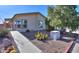 Desert home with easy-care landscaping, including native cacti and mature shade trees at 1855 N Rim Rock Dr, Casa Grande, AZ 85122
