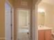 View of hallway with access to a bedroom and a bathroom, allowing for convenient navigation between spaces at 1855 N Rim Rock Dr, Casa Grande, AZ 85122