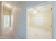 Hallway leading to bedroom with ceiling fan at 1855 N Rim Rock Dr, Casa Grande, AZ 85122