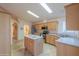 Bright kitchen boasting ample cabinet space, stainless steel appliances, and a functional center island at 1855 N Rim Rock Dr, Casa Grande, AZ 85122