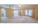 Open living space featuring carpeting, a ceiling fan, and seamless transitions to other rooms at 1855 N Rim Rock Dr, Casa Grande, AZ 85122