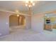 Spacious living room with a chandelier, plus easy access to the kitchen and dining areas at 1855 N Rim Rock Dr, Casa Grande, AZ 85122