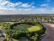 Beautiful aerial view featuring a community park with mature trees and walking paths at 21283 E Camacho Rd, Queen Creek, AZ 85142