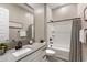 Bathroom featuring a vanity with a modern faucet and a shower-tub combo at 21283 E Camacho Rd, Queen Creek, AZ 85142