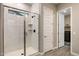 Bathroom showing a glass shower and a door to a laundry room at 21283 E Camacho Rd, Queen Creek, AZ 85142