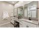 Bright bathroom with double sinks, framed mirrors and vanity at 21283 E Camacho Rd, Queen Creek, AZ 85142