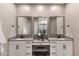 Bathroom featuring dual vanities, a makeup counter, and framed mirrors at 21283 E Camacho Rd, Queen Creek, AZ 85142