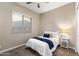 Bright bedroom featuring carpet floors, natural lighting, and a neutral color palette at 21283 E Camacho Rd, Queen Creek, AZ 85142