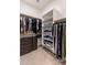 Organized walk-in closet with clothing racks, shelves and drawers at 21283 E Camacho Rd, Queen Creek, AZ 85142