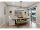Dining area with stylish lighting and sliding glass door access at 21283 E Camacho Rd, Queen Creek, AZ 85142