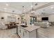 Bright kitchen with a large island, pendant lighting, and open access to the living and dining areas, ideal for gatherings at 21283 E Camacho Rd, Queen Creek, AZ 85142