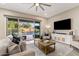 Bright living room with a sliding glass door to a pool at 21283 E Camacho Rd, Queen Creek, AZ 85142