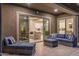 Inviting outdoor patio with comfortable seating that opens to the living area with a seamless indoor-outdoor flow at 21283 E Camacho Rd, Queen Creek, AZ 85142