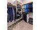 Spacious walk-in closet with ample shelving and hanging space for organized storage at 21283 E Camacho Rd, Queen Creek, AZ 85142