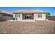 Backyard featuring gravel, covered patio and neutral color palette at 21551 E Waverly Ct, Queen Creek, AZ 85142