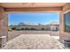 Covered patio with a view of the expansive backyard featuring a gravel landscape, and a storage shed at 21551 E Waverly Ct, Queen Creek, AZ 85142