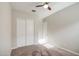 Neutral bedroom with carpet, closet, and ceiling fan at 21551 E Waverly Ct, Queen Creek, AZ 85142