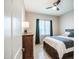 Comfortable bedroom with a queen-sized bed, dresser, and natural light from a window at 21551 E Waverly Ct, Queen Creek, AZ 85142