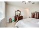 Bedroom with an antique dresser, ceiling fan, and great natural light at 21551 E Waverly Ct, Queen Creek, AZ 85142
