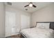 Bedroom with carpet, a bed, ceiling fan, and closet at 21551 E Waverly Ct, Queen Creek, AZ 85142