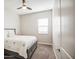 Cozy bedroom with a comfortable bed, soft carpet, and a ceiling fan at 21551 E Waverly Ct, Queen Creek, AZ 85142