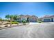Charming single-story home featuring stone accents, a two-car garage, and meticulously maintained landscaping at 21551 E Waverly Ct, Queen Creek, AZ 85142
