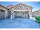 Spacious three-car garage with ample storage space and a well-maintained concrete floor at 21551 E Waverly Ct, Queen Creek, AZ 85142