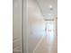 Bright hallway with neutral walls and tiled flooring leading to the living area at 21551 E Waverly Ct, Queen Creek, AZ 85142