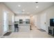 Bright kitchen with stainless steel appliances, granite countertops, breakfast bar, and ample storage at 21551 E Waverly Ct, Queen Creek, AZ 85142