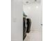 Modern laundry room with sleek black washer and dryer units at 21551 E Waverly Ct, Queen Creek, AZ 85142