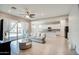 Open-concept living space featuring tile flooring and sliding glass doors for natural light at 21551 E Waverly Ct, Queen Creek, AZ 85142