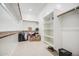 Spacious walk-in closet with shelving and hanging space for organized storage solutions at 21551 E Waverly Ct, Queen Creek, AZ 85142