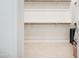 Walk-in closet with custom shelving and metal hanging rods providing plentiful storage at 21551 E Waverly Ct, Queen Creek, AZ 85142