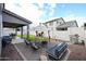Spacious backyard featuring covered patio, desert landscaping, BBQ grill and an outdoor seating area at 2158 N 212Th Ave, Buckeye, AZ 85396