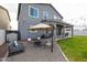 Large backyard offers covered patio, lounge area and desert landscaping at 2158 N 212Th Ave, Buckeye, AZ 85396