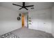 Spacious bedroom with a ceiling fan, carpet, and sliding closet doors, with storage and display space at 2158 N 212Th Ave, Buckeye, AZ 85396